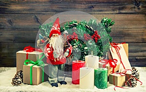 Christmas decoration Santa Claus, gift boxes, burning candles. V