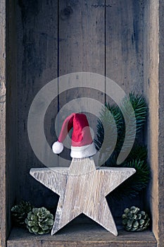 Christmas decoration Santa Clause hat on a star in a wooden box