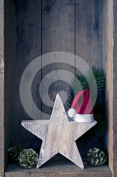 Christmas decoration Santa Clause hat on a star in a wooden box