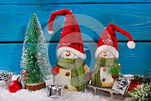 Christmas decoration with santa figurines on wooden background