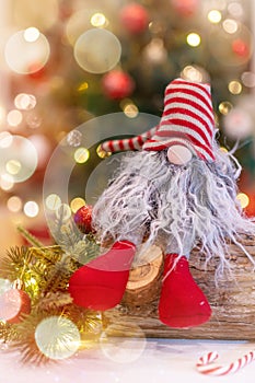 Christmas decoration with Santa hat and toy. Winter season holiday with light bokeh