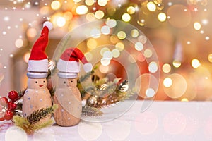 Christmas decoration with Santa hat and toy. Winter season holiday with light bokeh