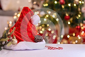 Christmas decoration with Santa hat and toy. Winter season holiday with light bokeh