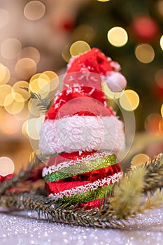 Christmas decoration with Santa hat and toy. Winter season holiday with light bokeh