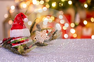 Christmas decoration with Santa hat and toy. Winter season holiday with light bokeh