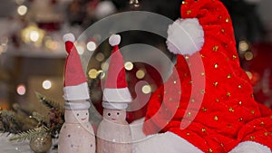 Christmas decoration with Santa hat and toy. Winter season holiday with light bokeh background