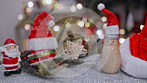 Christmas decoration with Santa hat and toy. Winter season holiday with light bokeh background