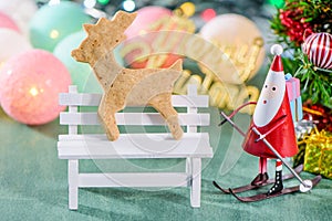 Christmas decoration, skating santa claus with gingerbread Man and Christmas imagery isolated on green background