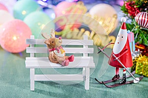 Christmas decoration, skating santa claus with reindeer decoration and Christmas imagery isolated on green background