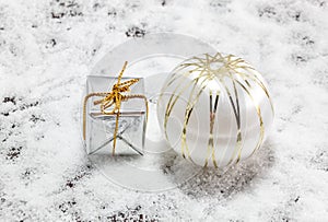 Christmas decoration and snow fake on wood background.