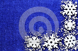 Christmas decoration.Snowflakes border on blue background with copyspace.Christmas snowflakes.Christmas border. photo
