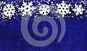 Christmas decoration.Snowflakes border on blue background with copyspace. photo