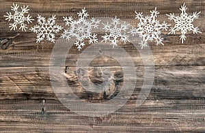 Christmas decoration Snowflakes border wooden background