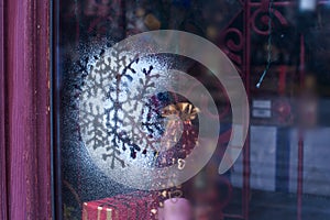 Christmas decoration snowflakes sputtering on glass