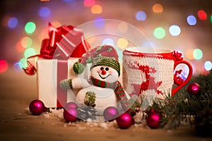 Christmas Decoration with snowman. Wooden Background.