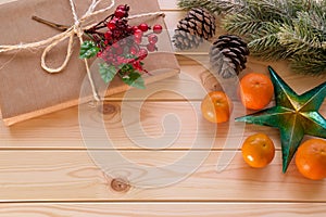 Christmas decoration - star, fir tree branch, gift and mandarins