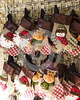 Christmas decoration stocking and toys hanging over rustic stone background