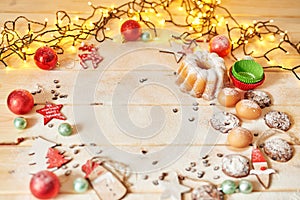 Christmas decoration on the table with a cupcake and cookies