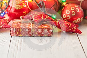 Christmas decoration, toys and ornaments. Red stars, baubles, ribbons. Holidays background.