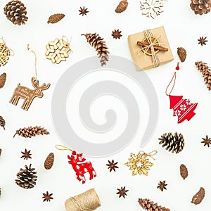 Christmas decoration, tree, snowflakes and pine cones on white. Flat lay, top view. Frame concept.