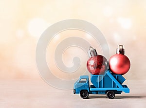 Christmas decoration. Truck car carries decorations for Christmas trees. Christmas ball