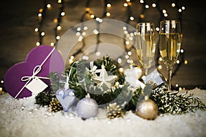 Christmas decoration with two glasses of champagne and gift