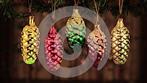 Christmas decoration - vintage pine cone toys with green laser beams.