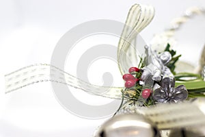 Christmas decoration with white ribbon andsilver angel.