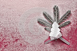 Christmas Decoration with White Wooden Christmas Tree on Red Snowy Background. Copy Space Wallpaper. Christmas Card.