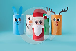 Christmas decoration for winter season. Holiday easy DIY craft idea for kids. Toilet paper roll tube toy. Santa snowman