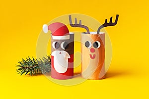 Christmas decoration for winter season. Holiday easy DIY craft idea for kids. Toilet paper roll tube toy. Santa snowman