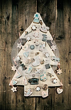 Christmas decoration: wooden carved tree decorated with gingerbread.