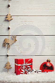 Christmas decorations against wooden wall