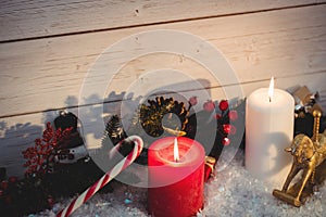 Christmas decorations against wooden wall