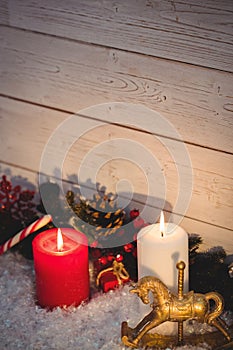 Christmas decorations against wooden wall