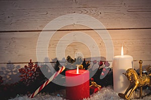 Christmas decorations against wooden wall