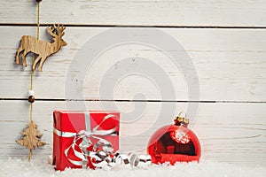 Christmas decorations against wooden wall