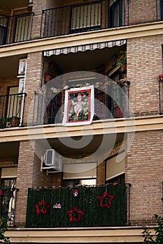 Christmas decorations on the balconies of a building in a Spanish city