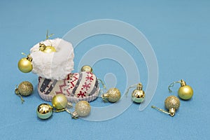 Christmas decorations balls and boots on blue background. Winter holidays concept. Xmas and New year theme