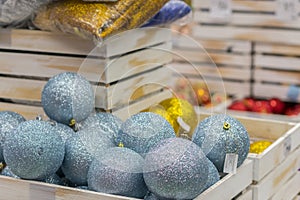 Christmas decorations in boxes. Balls for Christmas tree of blue light. Christmas preparation concept. Christmas background for