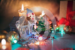 Christmas decorations, burning candles, garlands, lights, balls