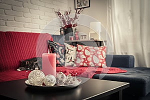Christmas decorations with candle on coffee table