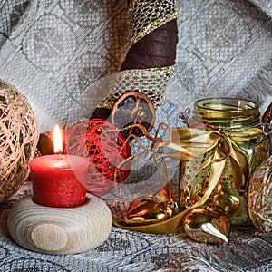 Christmas decorations with candle, ribbons and balls