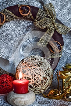 Christmas decorations with candle, ribbons and balls