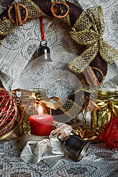 Christmas decorations with candle, ribbons and balls