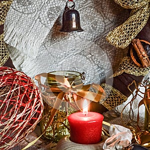 Christmas decorations with candle, ribbons and balls