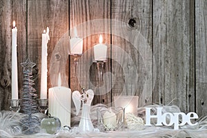 Christmas decorations and candles by wood background