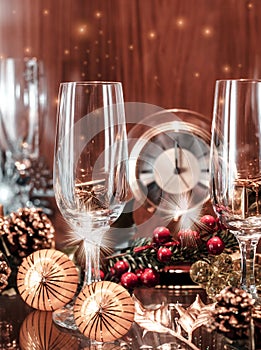 Christmas decorations with champagne glasses and a midnight clock to celebrate the new year