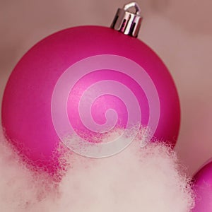 Christmas decorations. Christmas pink balls and cotton wool