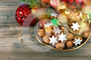 Christmas decorations with cinnamon star cookies and walnuts